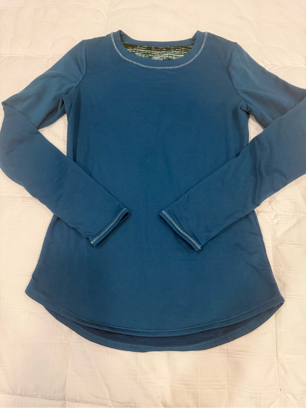Stay warm in this like new Climate Right CuddlDuds long sleeve top. Teal, small.